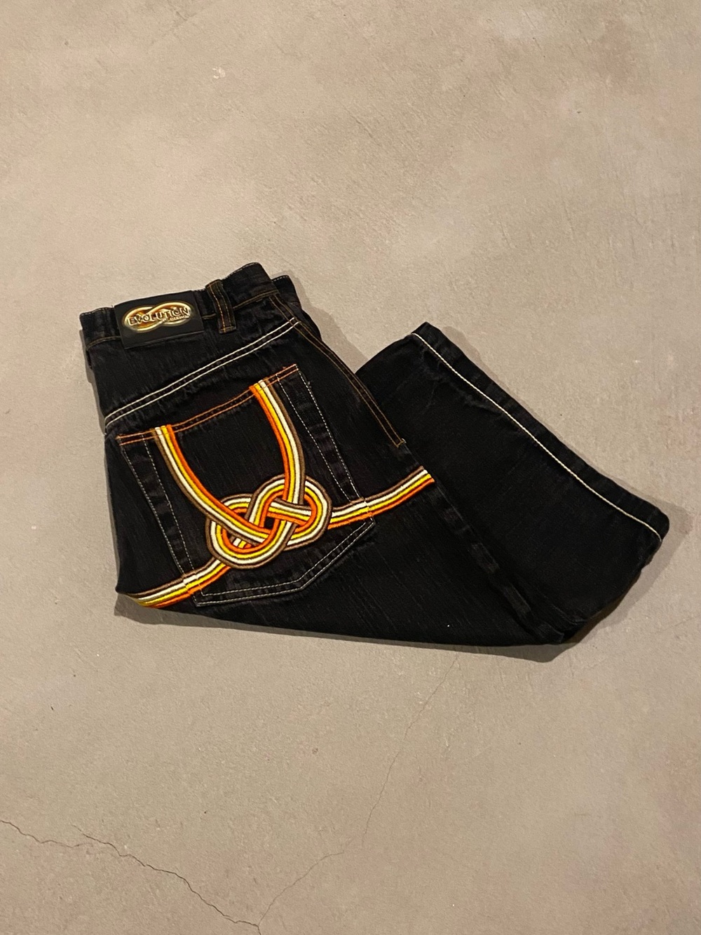 Vintage Y2K Black Revolution Jean Shorts with Orange and Yellow Details